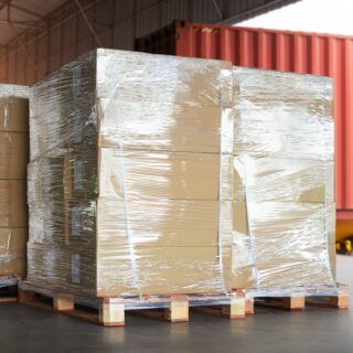 Packaging,Boxes,Wrapped,Plastic,Stacked,On,Pallets,Loading,Into,Cargo