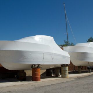 Two,Motor,Boats,Wrapped,,Packaged,,In,White,Plastic,Material,And